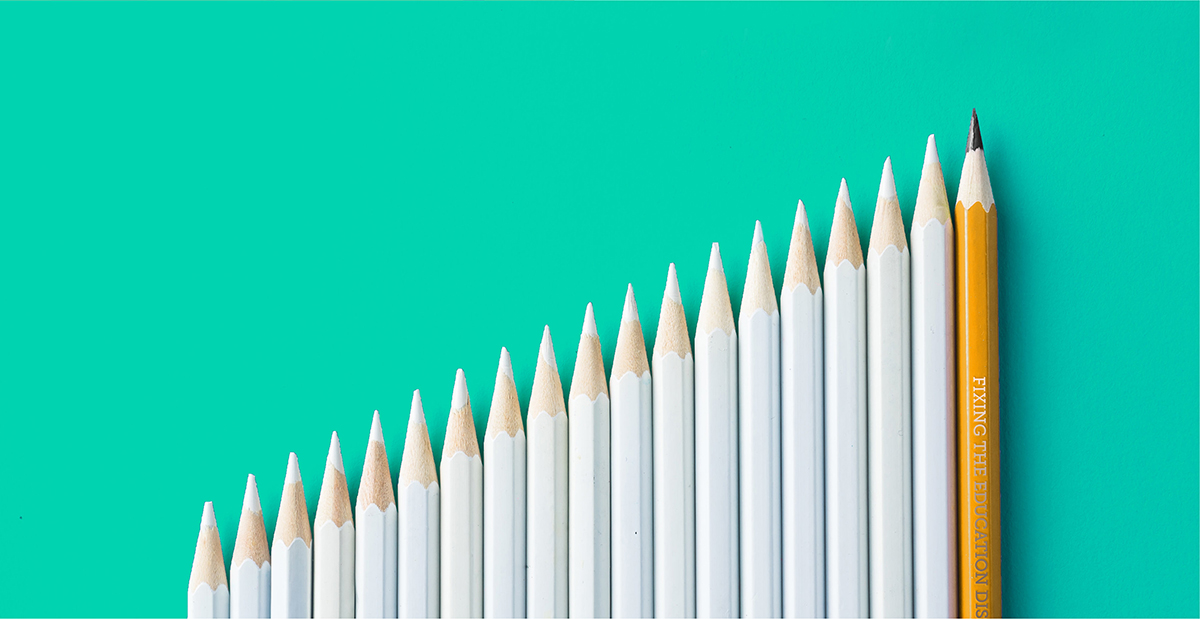 white pencils layout next to each other with tan pencil on the end, collectively creating upward trend line horizontally across teal background