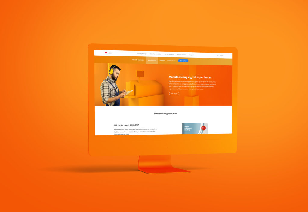 Manufacturing Digital Experiences page orange desktop mockup with orange background showing the hero and beginning content